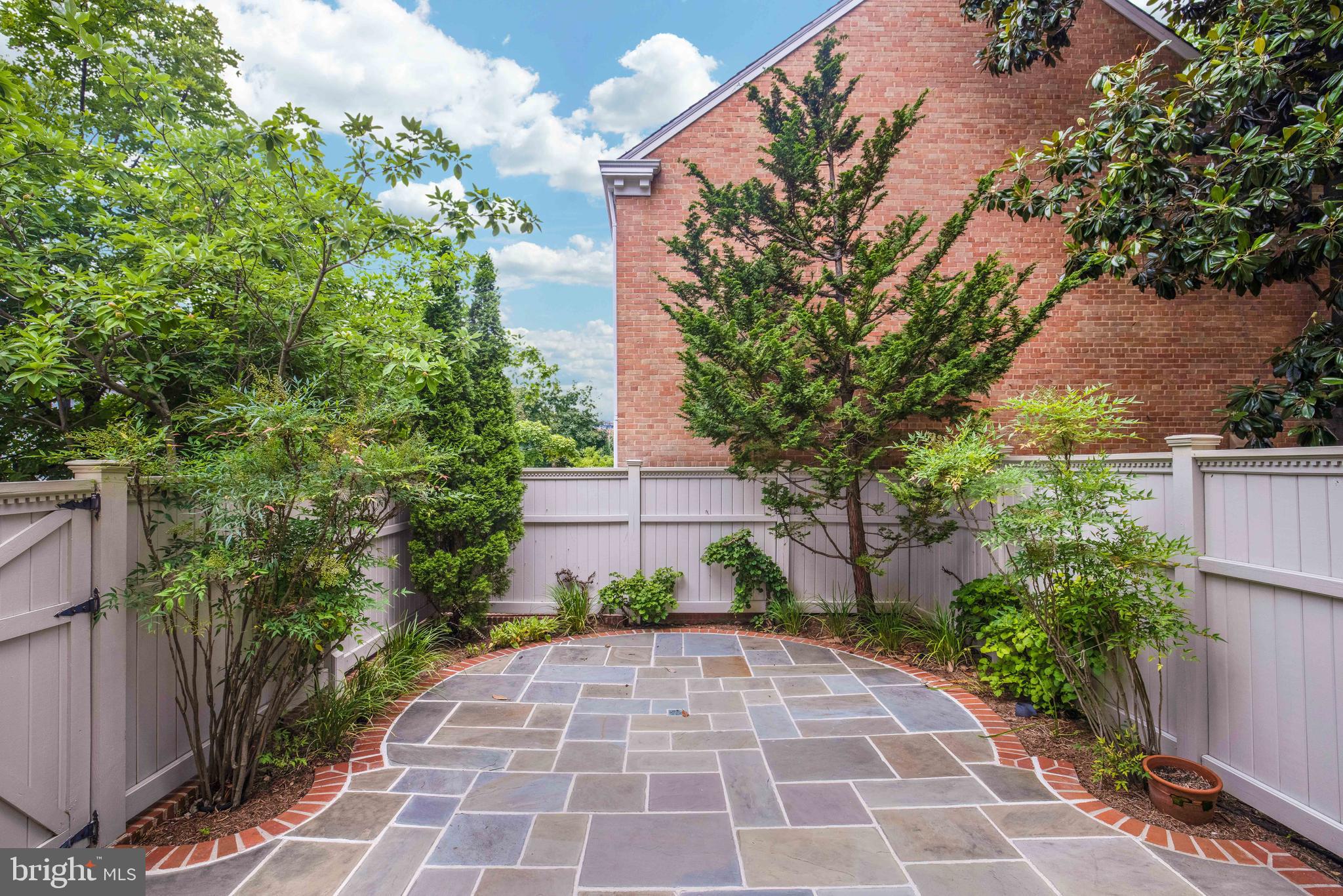 3327 R Street Northwest Washington, DC 20007 - Photo 35 of 39 a pathway with a yard