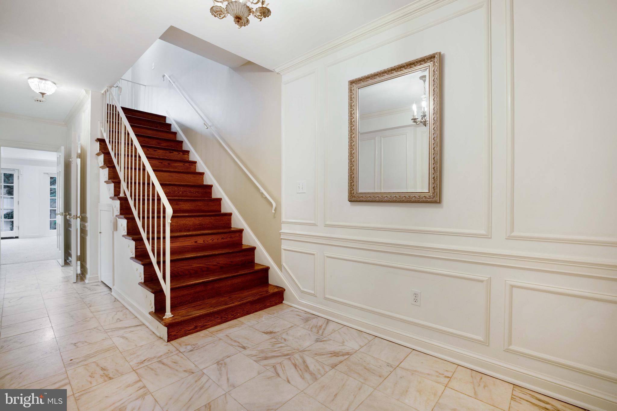 3327 R Street Northwest Washington, DC 20007 - Photo 4 of 39 a view of a hallway with entryway wooden floor and front door