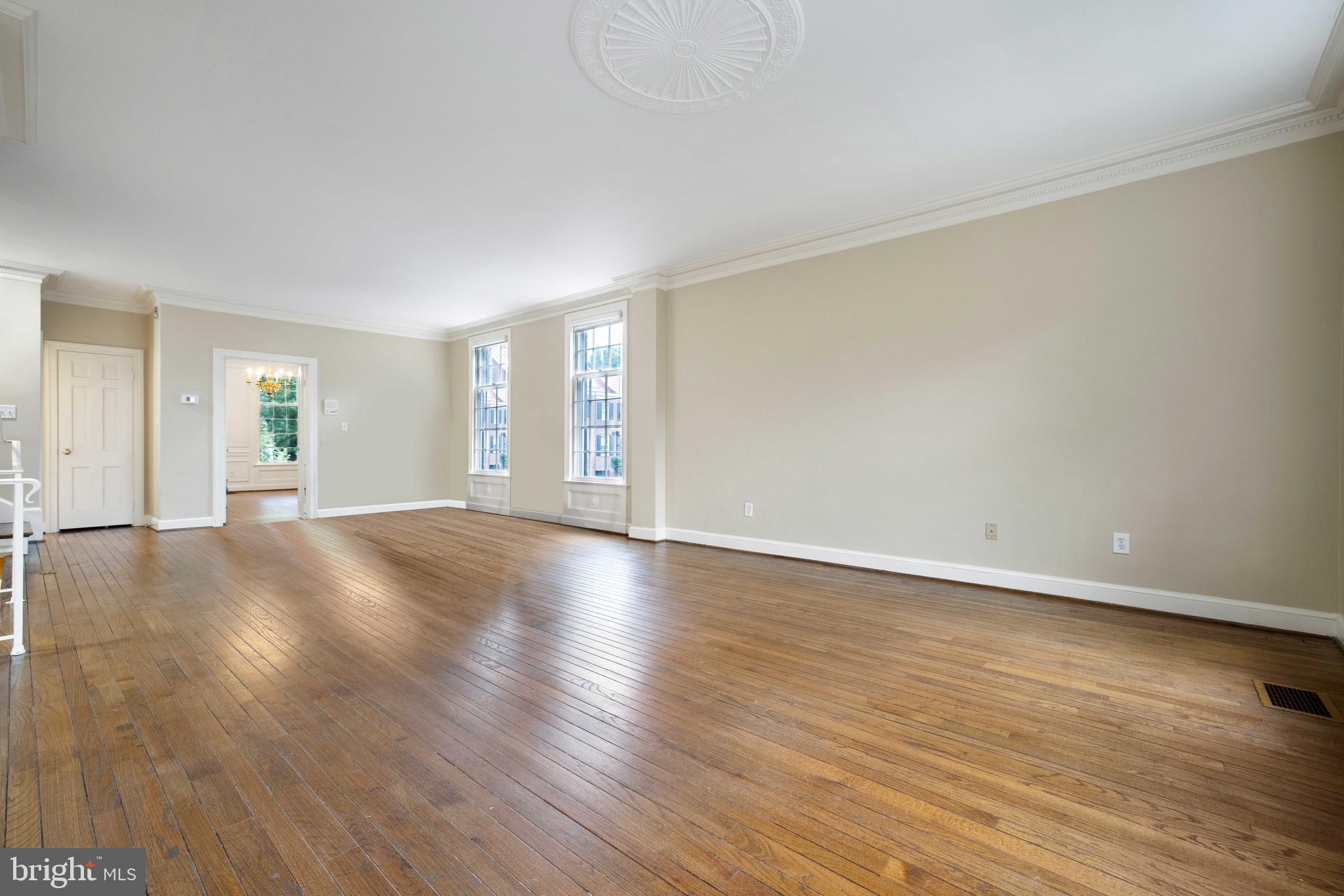 3327 R Street Northwest Washington, DC 20007 - Photo 5 of 39 a view of a livingroom with wooden floor and window