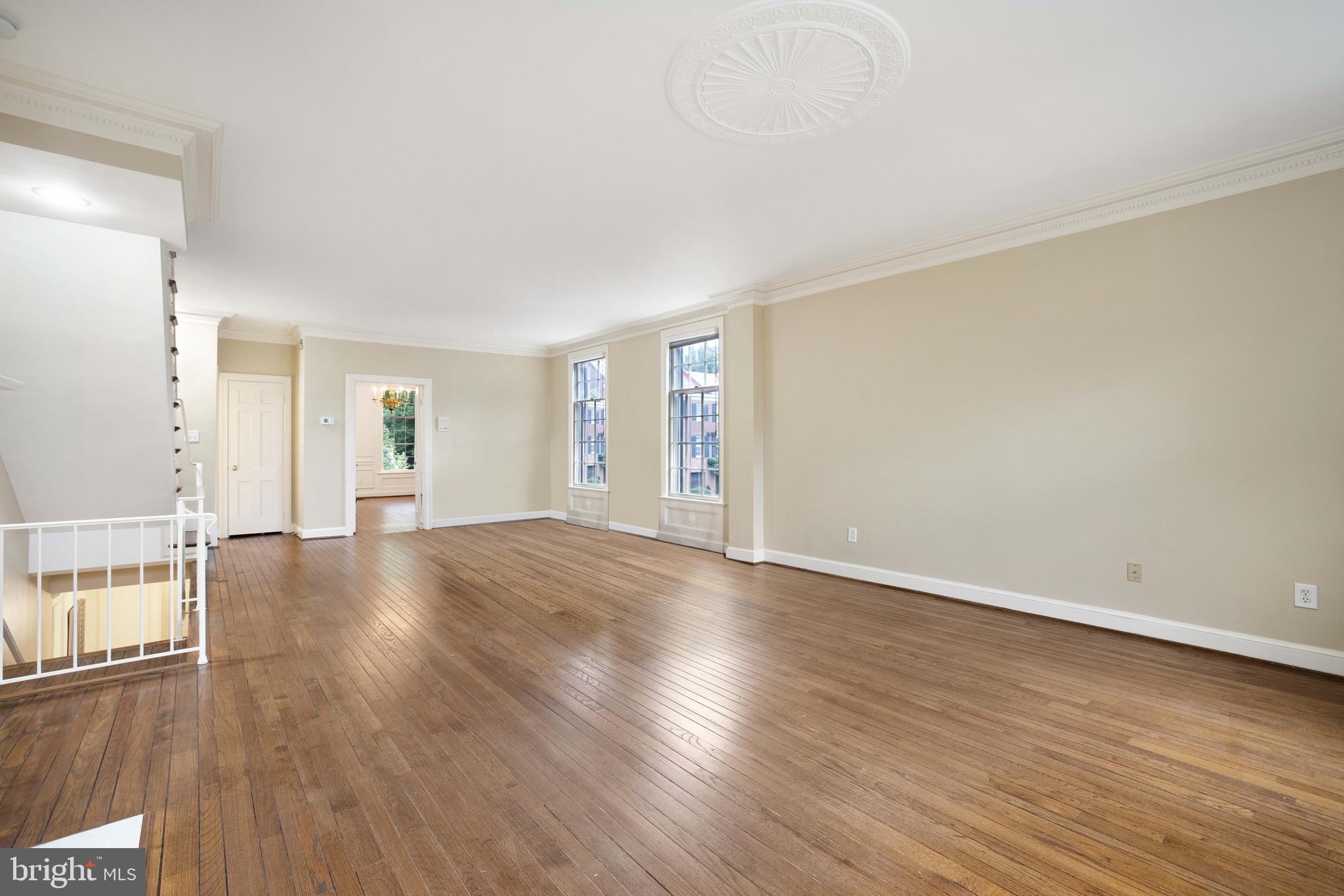 3327 R Street Northwest Washington, DC 20007 - Photo 9 of 39 an empty room with wooden floor and windows
