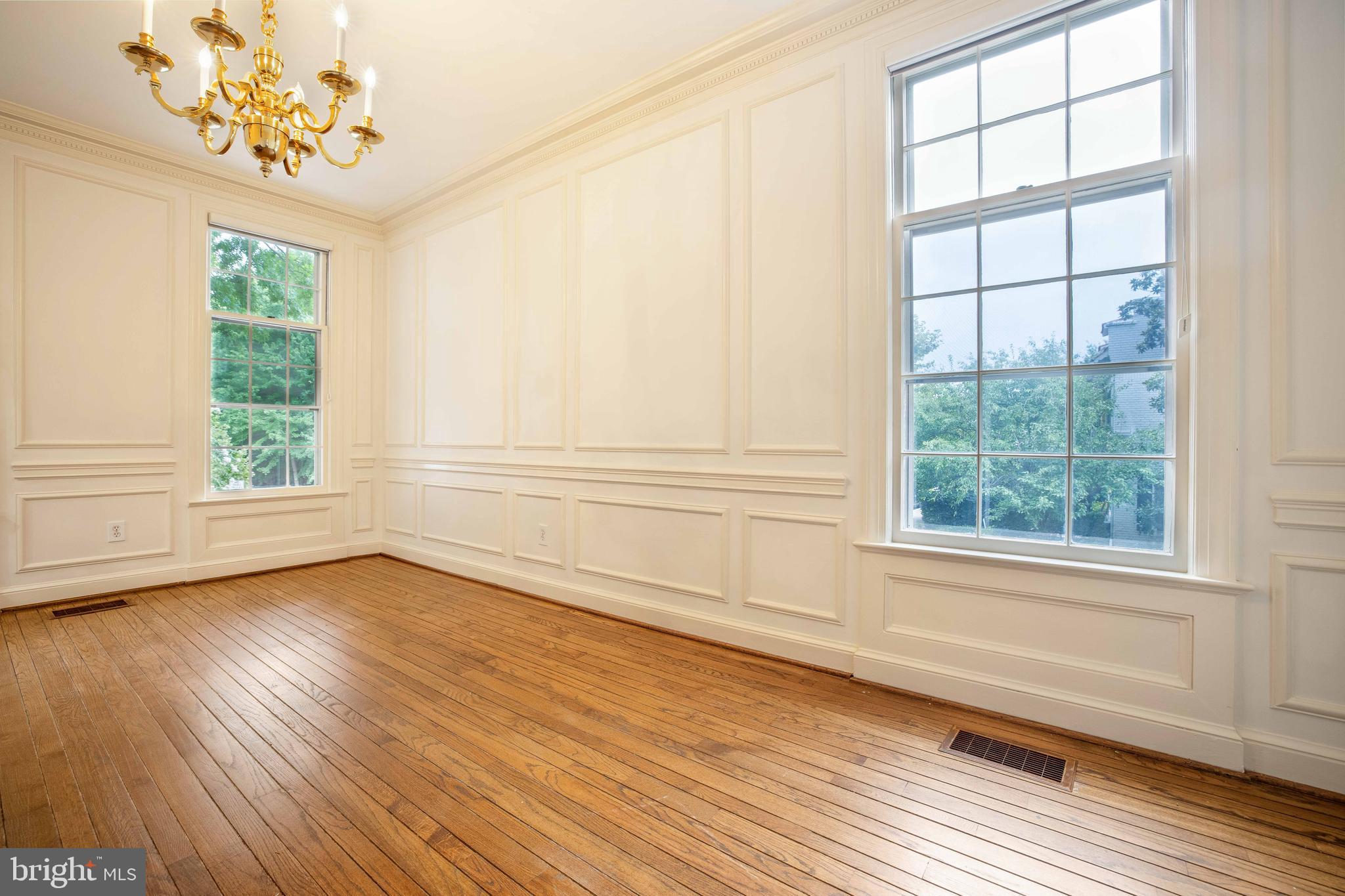 3327 R Street Northwest Washington, DC 20007 - Photo 10 of 39 a view of a livingroom with wooden floor and a large window