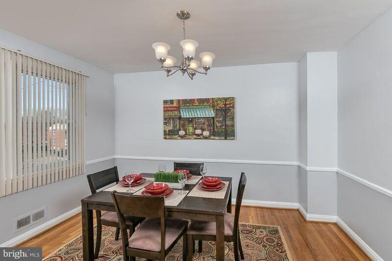 6202 Falkirk Road Baltimore, MD 21239 - Photo 8 of 22 a view of a dining room with furniture and chandelier