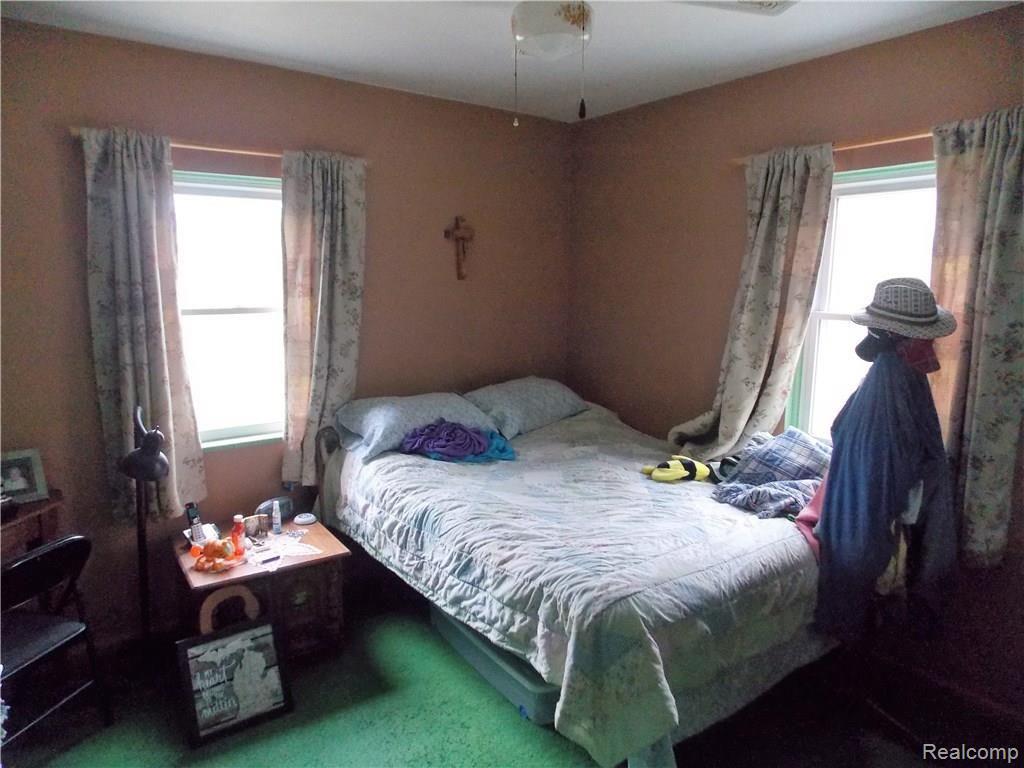 1200 North Maple Leaf Road Lapeer, MI 48446 - Photo 8 of 22 The master bedroom on the main floor has windows to the east and north. All the windows have been updated to vinyl tilt in, and are in very good condition.