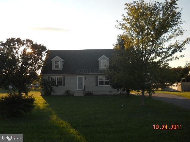 a view of house with garden space and trees