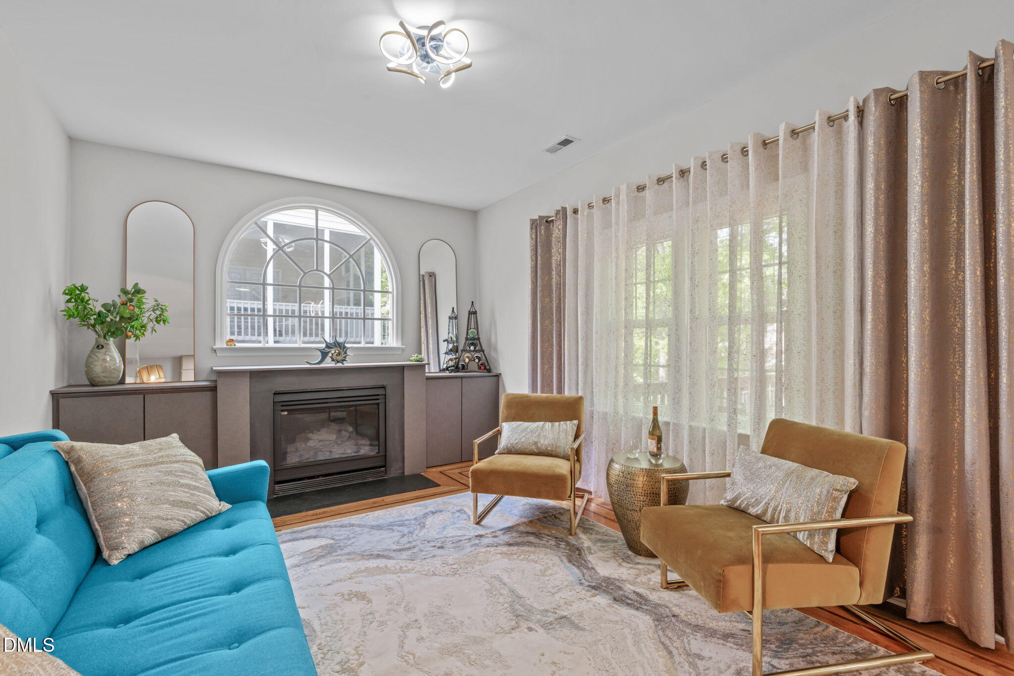 104 Lost Tree Lane Cary, NC 27513 - Photo 11 of 54 a living room with furniture and a fireplace