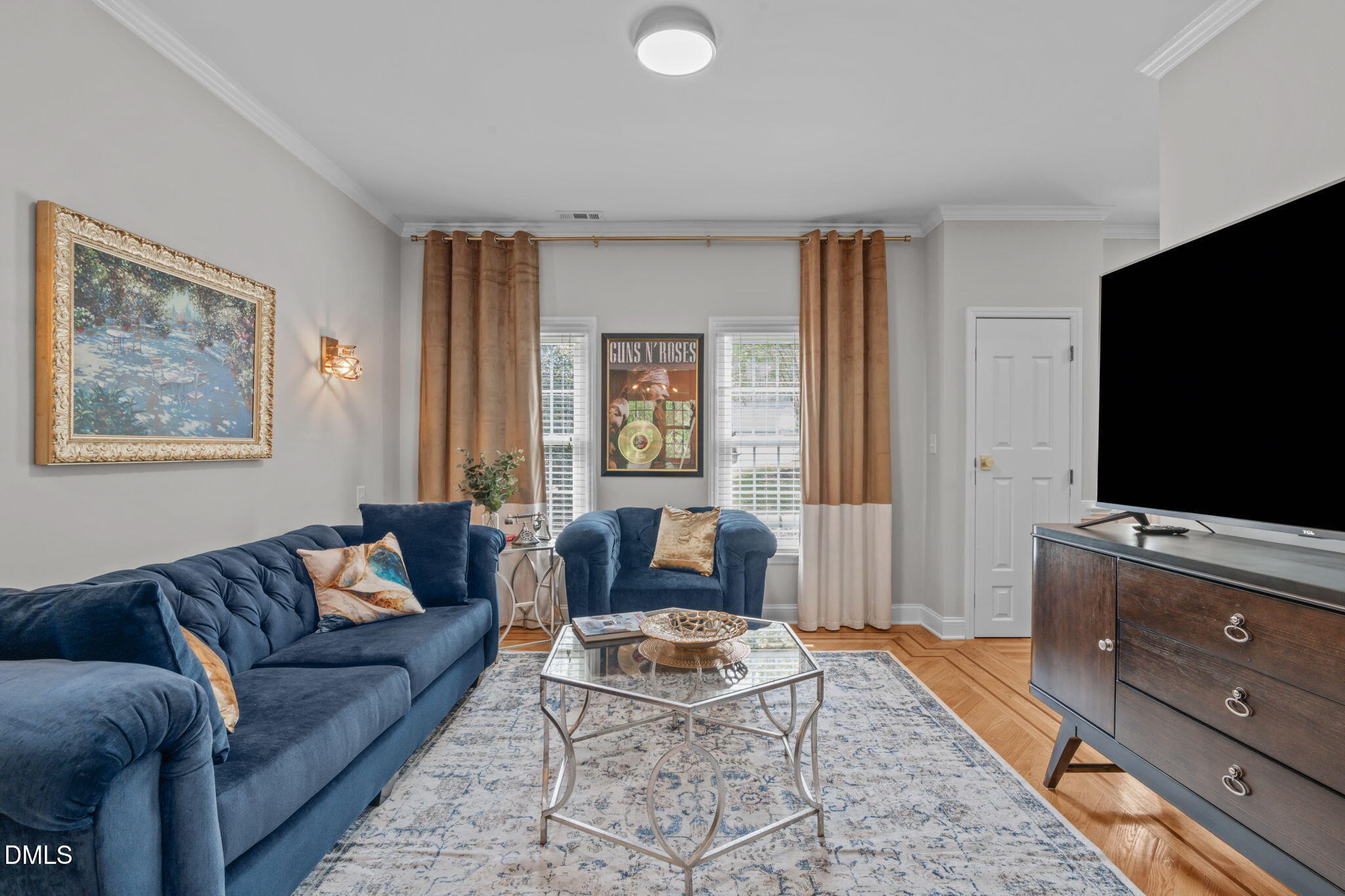 104 Lost Tree Lane Cary, NC 27513 - Photo 16 of 54 a living room with furniture and a flat screen tv