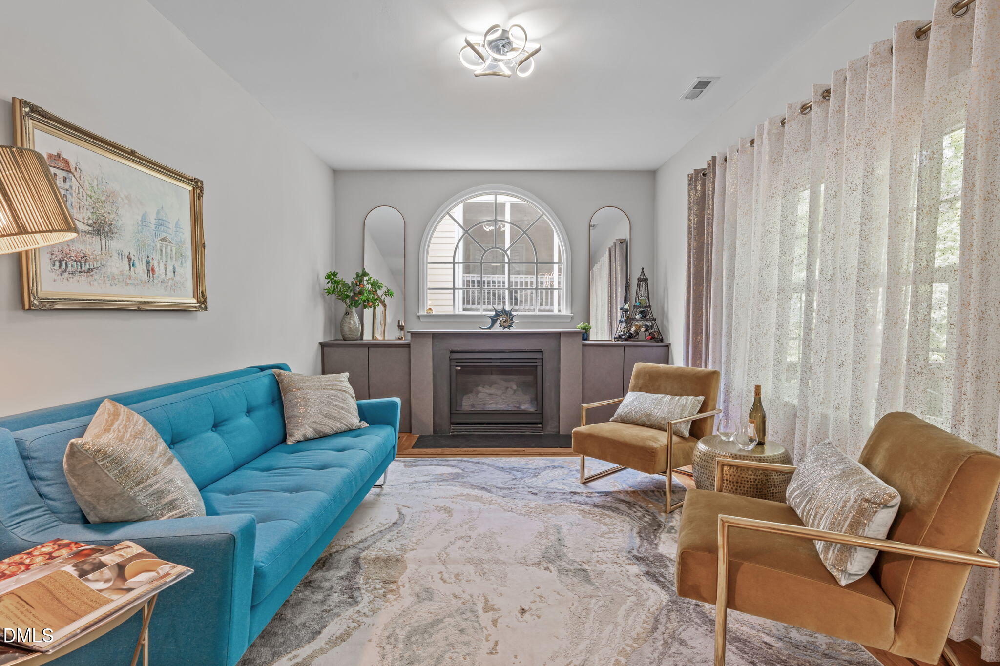 104 Lost Tree Lane Cary, NC 27513 - Photo 17 of 54 a living room with furniture and a fireplace