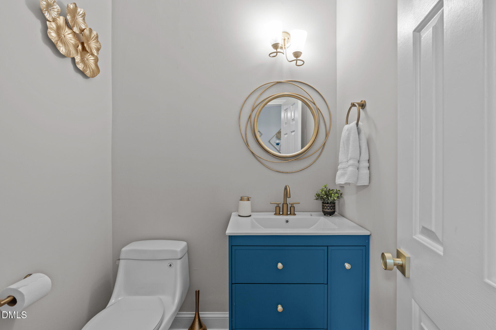 104 Lost Tree Lane Cary, NC 27513 - Photo 18 of 54 a bathroom with a toilet a sink and a mirror