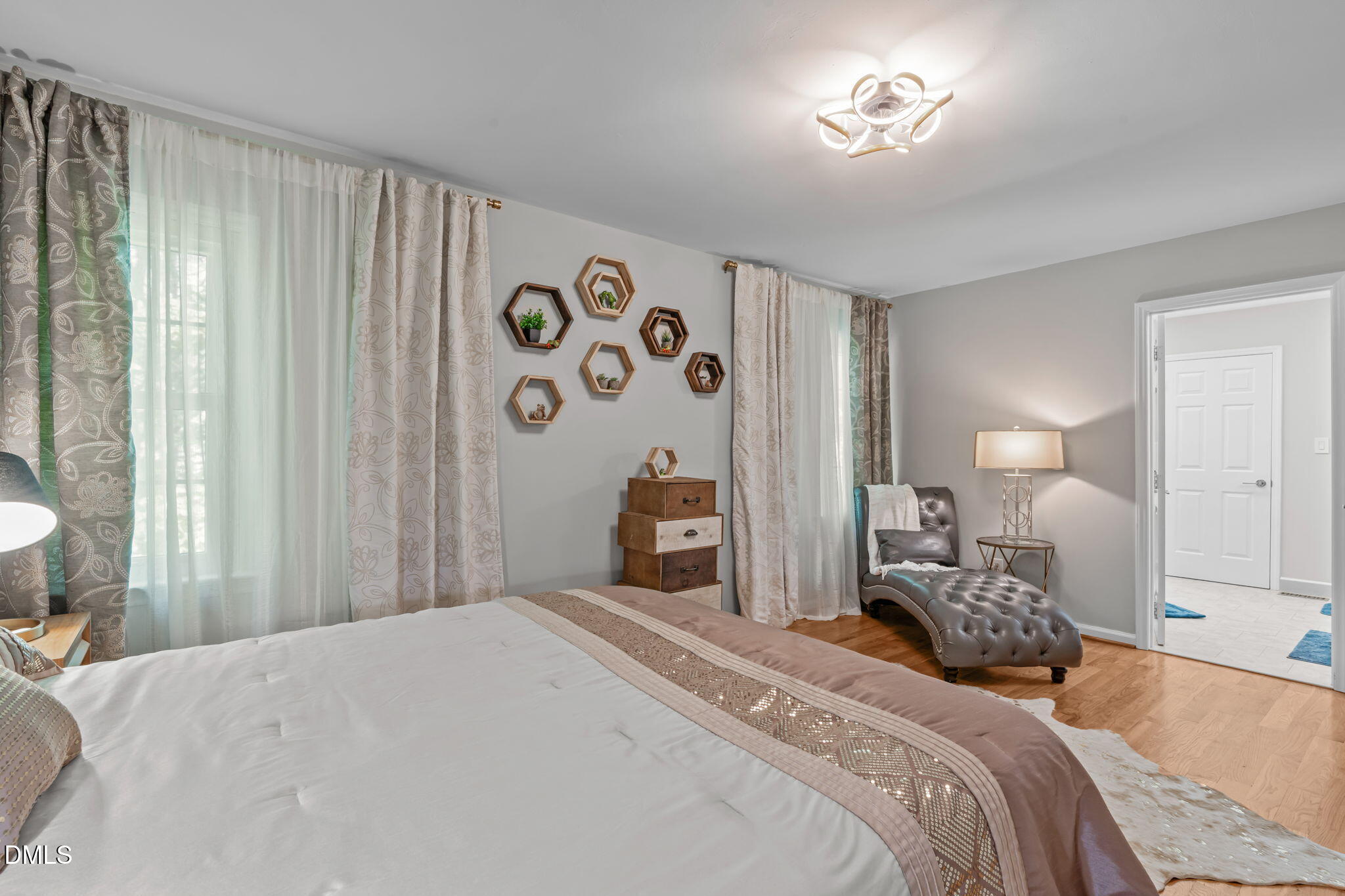 104 Lost Tree Lane Cary, NC 27513 - Photo 22 of 54 a bedroom with a bed and a lamp