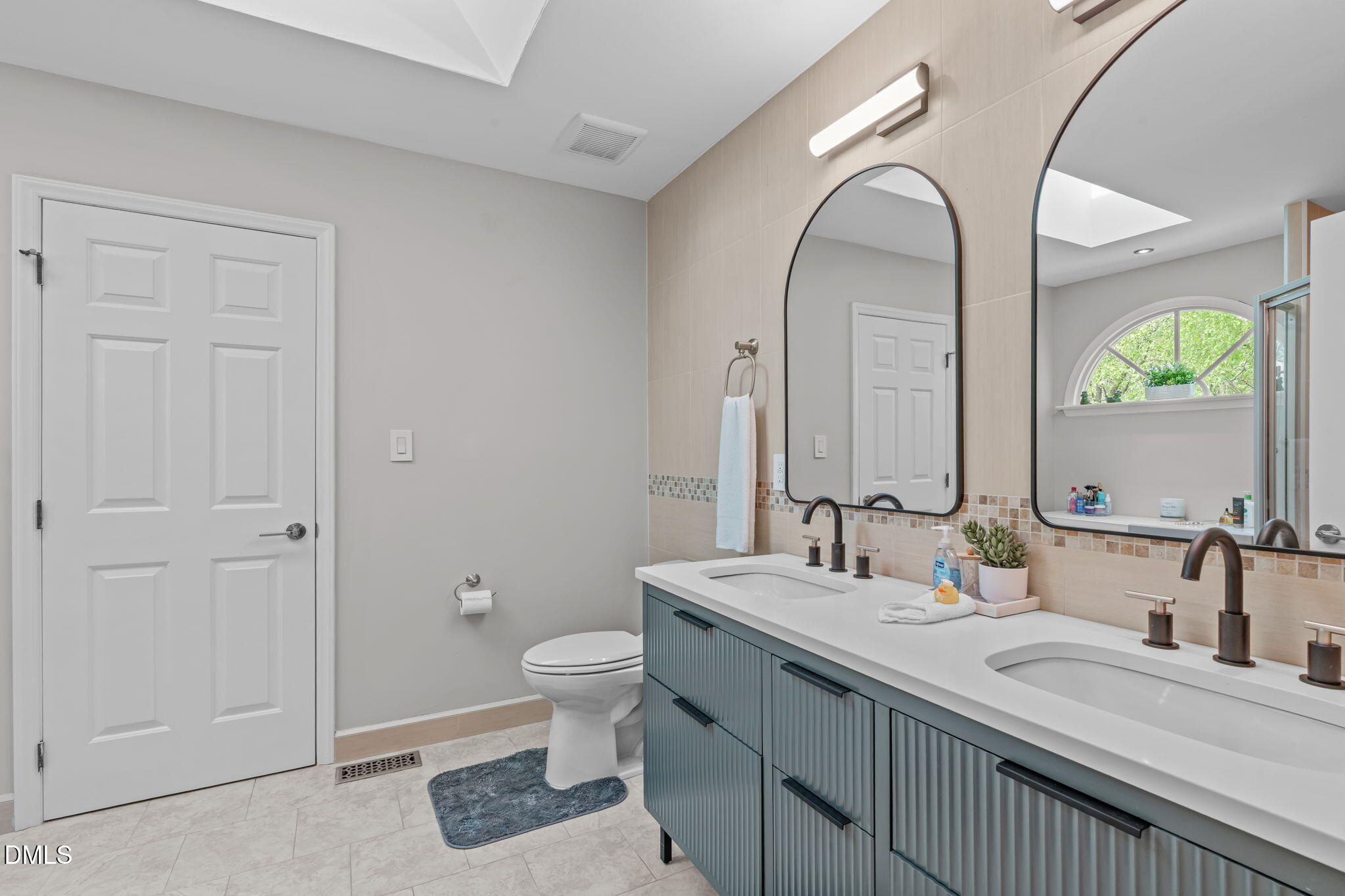 104 Lost Tree Lane Cary, NC 27513 - Photo 23 of 54 a bathroom with 2 sink and a mirror