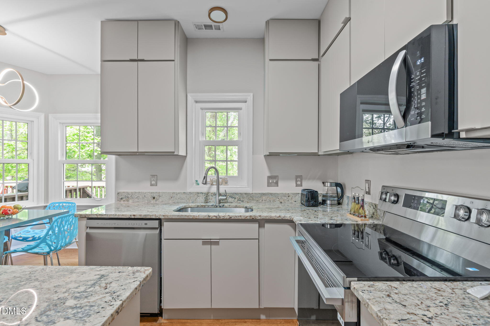 104 Lost Tree Lane Cary, NC 27513 - Photo 2 of 54 a kitchen with stainless steel appliances granite countertop a sink stove and cabinets