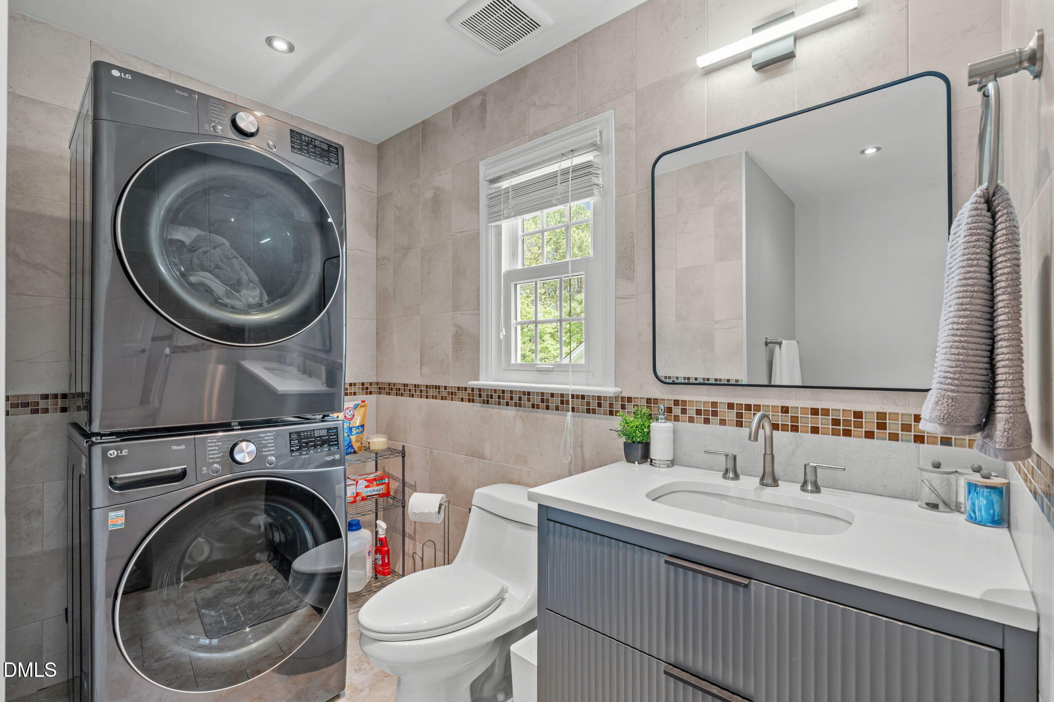 104 Lost Tree Lane Cary, NC 27513 - Photo 32 of 54 a bathroom with a sink mirror a toilet and a window