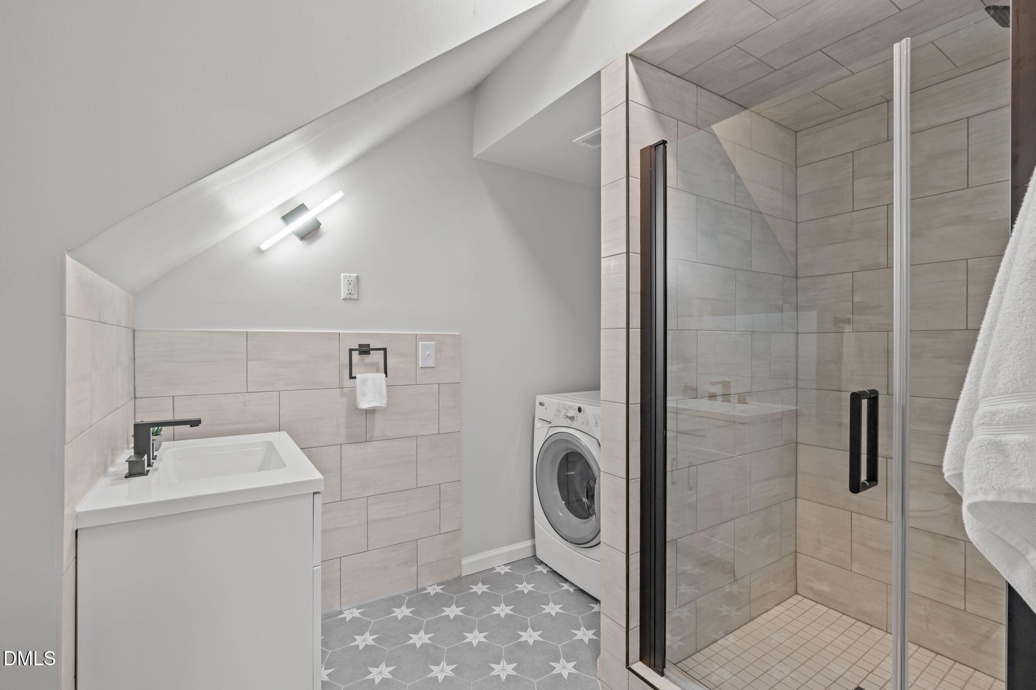 104 Lost Tree Lane Cary, NC 27513 - Photo 39 of 54 a bathroom with a sink and washing machine