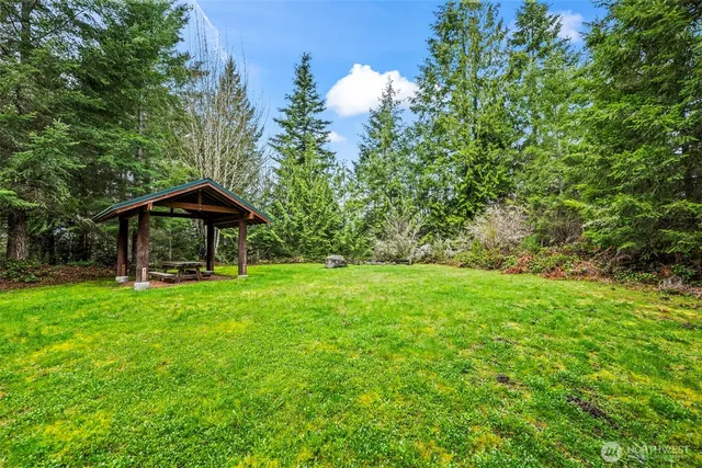 a view of a table and chairs under an umbrella