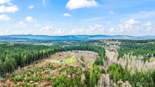 a view of a lake with houses in the back
