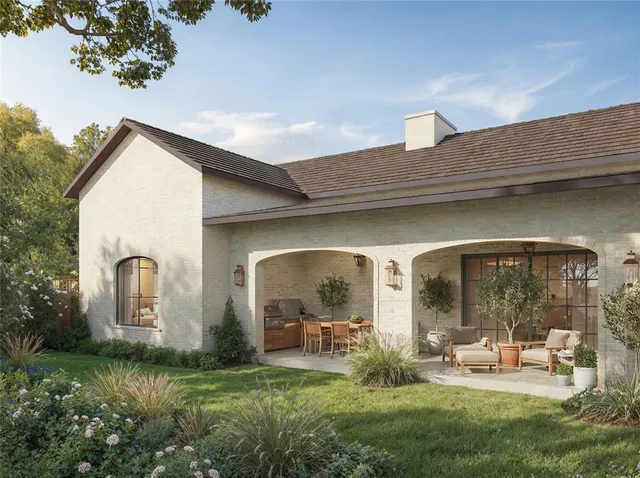 a view of a house with backyard porch and garden