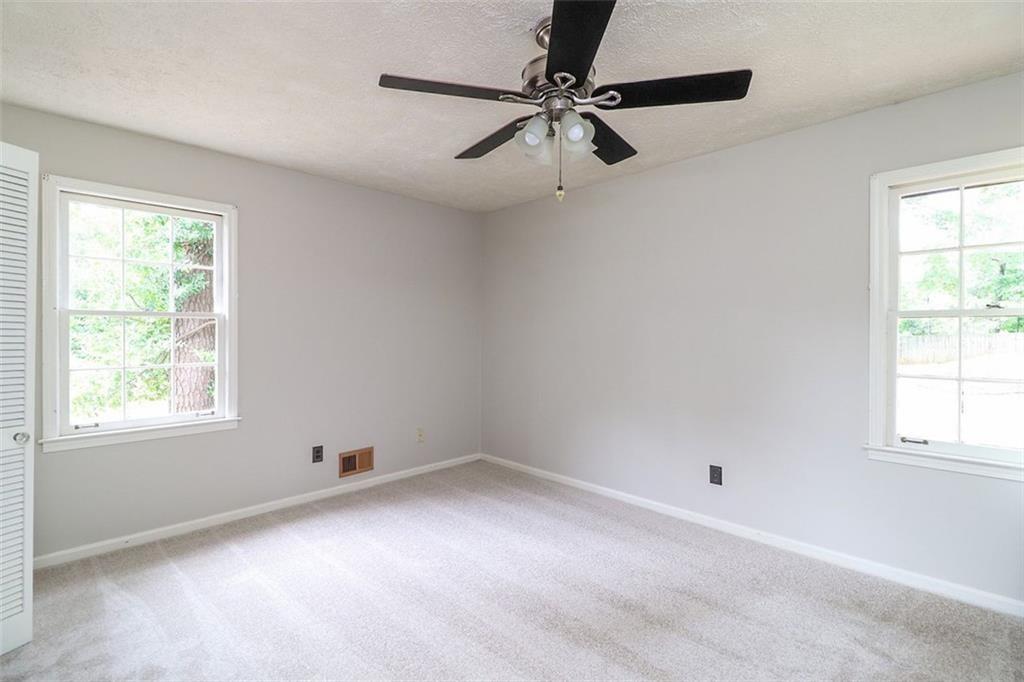 1291 Stephens Street Southwest Lilburn, GA 30047 - Photo 21 of 22 a view of a window in an empty room