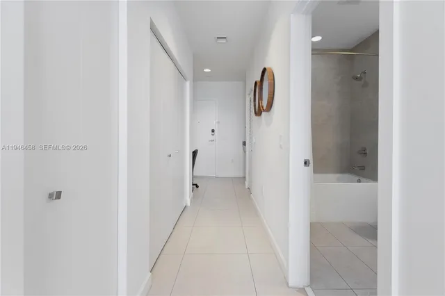 a bathroom with a shower and a sink