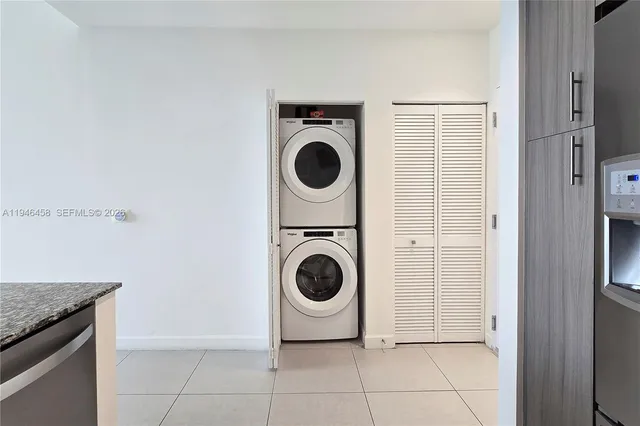 a view of swimming pool with outdoor seating and city view