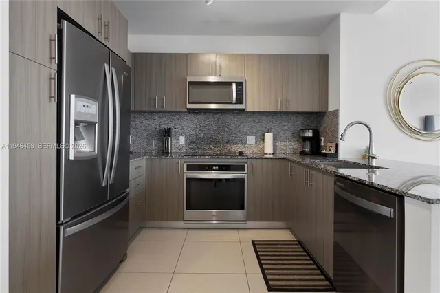 a kitchen with a sink stove and refrigerator