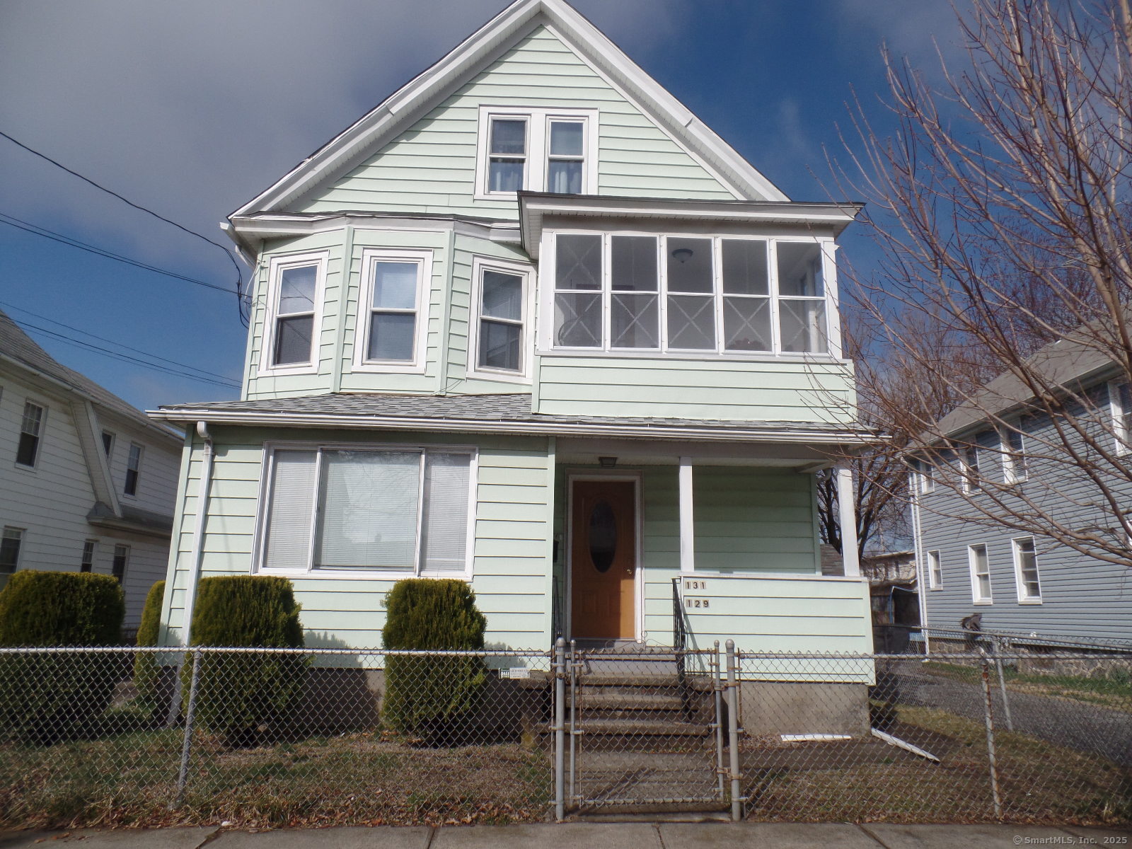 131 Kent Avenue Bridgeport, CT 06610 - Photo 1 of 1 a front view of a house with parking space
