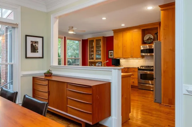 a living room with furniture and large windows