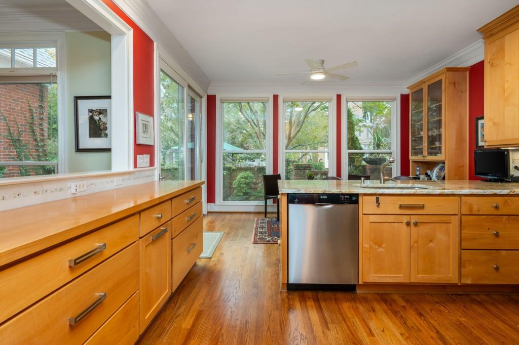 676 Clifton Road Northeast Atlanta, GA 30307 - Photo 16 of 45 a view of a kitchen with kitchen island wooden floors and stainless steel appliances