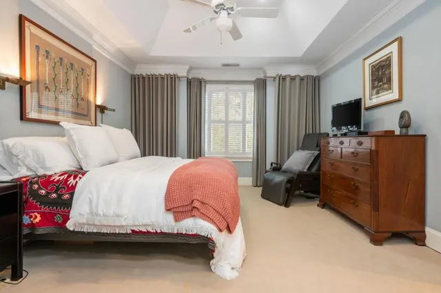 a bedroom with a bed and a couch