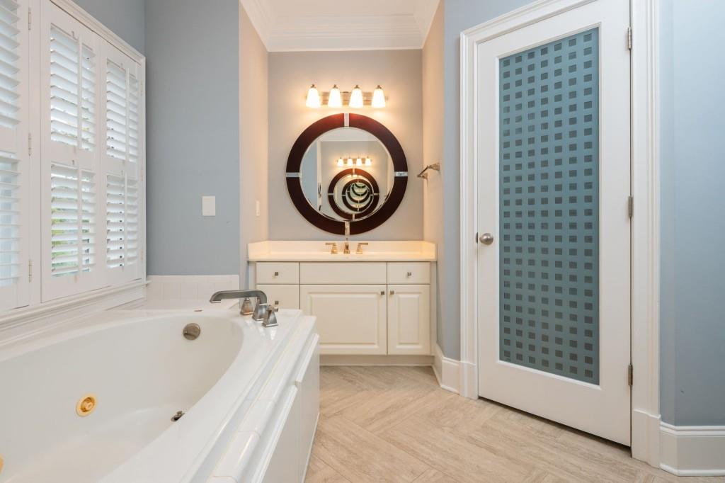676 Clifton Road Northeast Atlanta, GA 30307 - Photo 32 of 45 a bathroom with a bathtub a shower and a sink