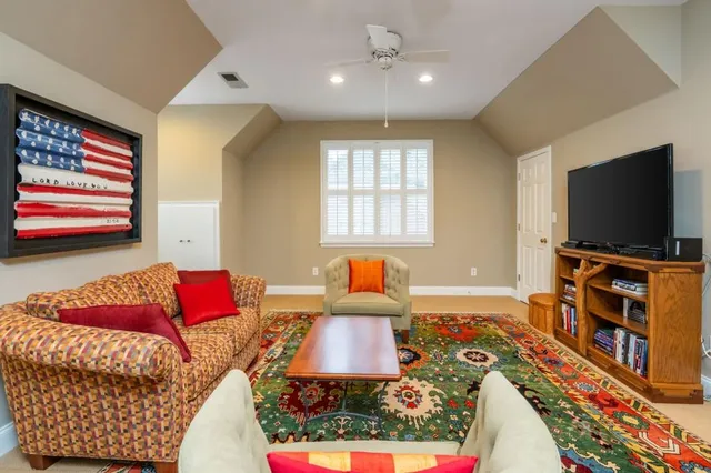 a living room with a couch and a flat screen tv