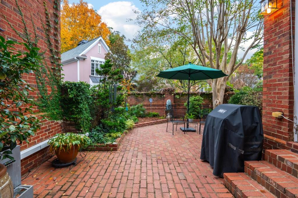 676 Clifton Road Northeast Atlanta, GA 30307 - Photo 44 of 45 a view of a chairs and table under an umbrella in patio