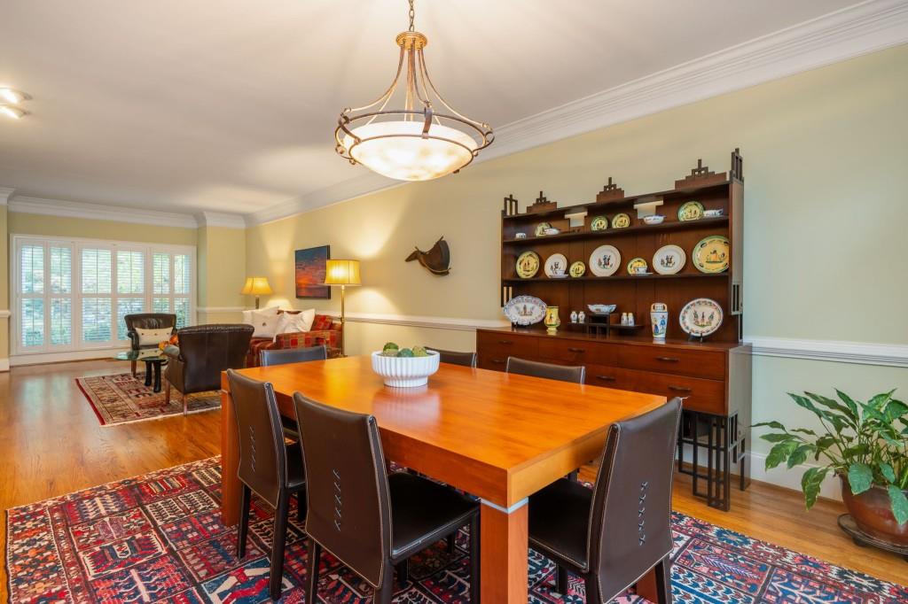 676 Clifton Road Northeast Atlanta, GA 30307 - Photo 9 of 45 a view of a dining room with furniture and chandelier