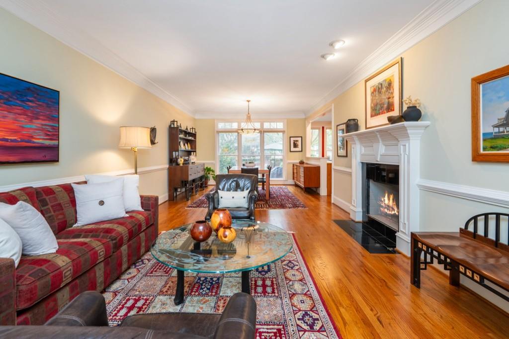 676 Clifton Road Northeast Atlanta, GA 30307 - Photo 10 of 45 a living room with furniture and a fireplace