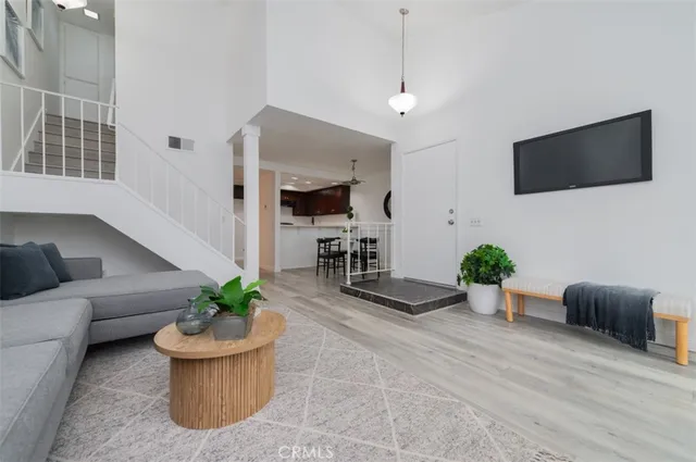 a room with furniture and a flat screen tv