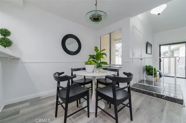a view of a dining room with furniture and window