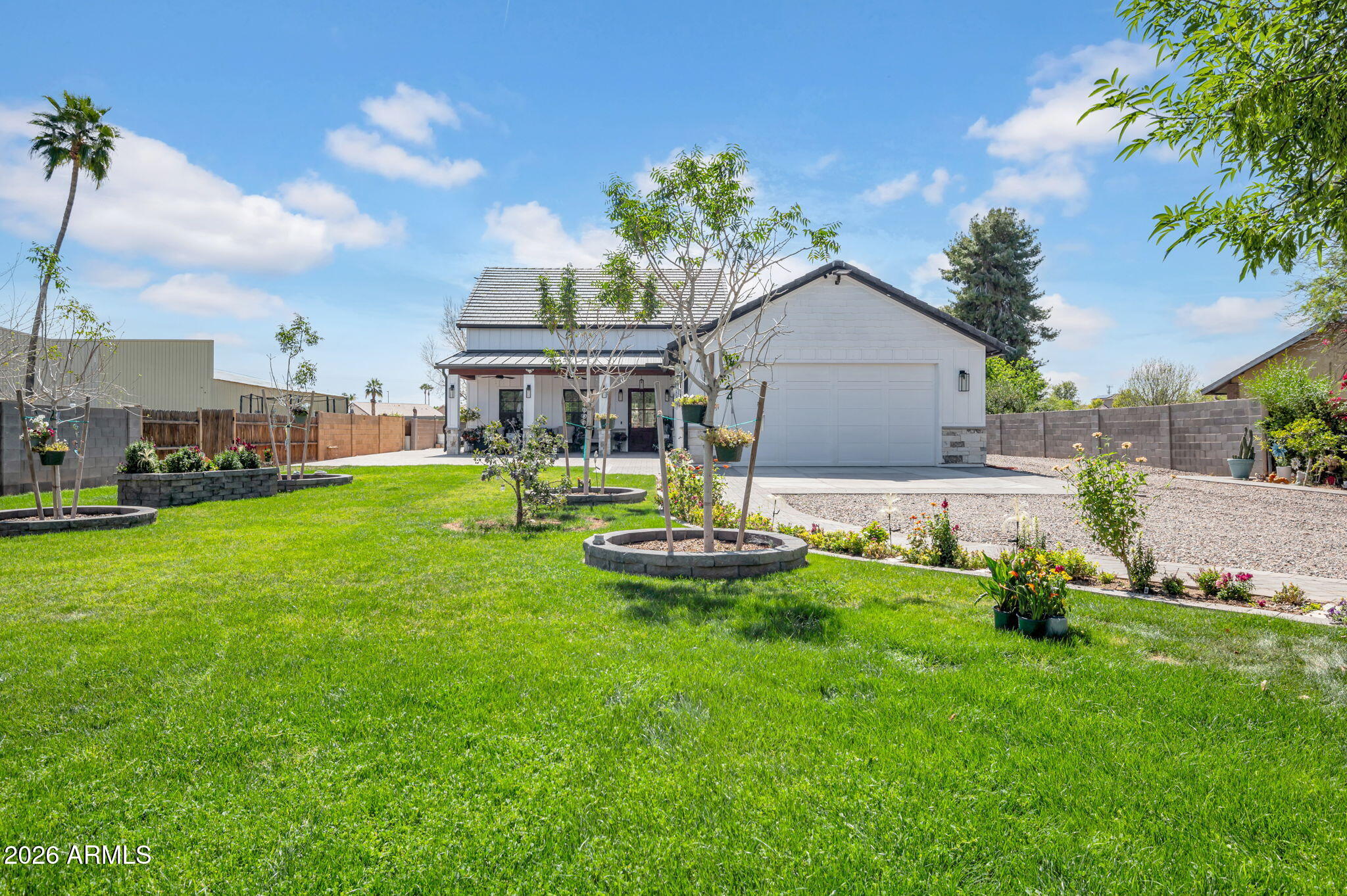 a front view of house with a garden and patio