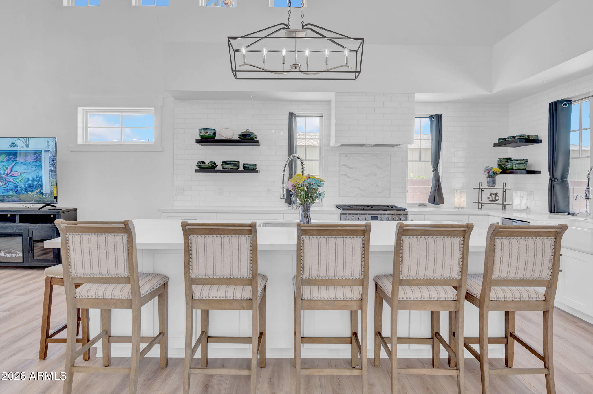 159 East Water Tank Road Gilbert, AZ 85296 - Photo 11 of 45 a kitchen with a dining table chairs and white cabinets