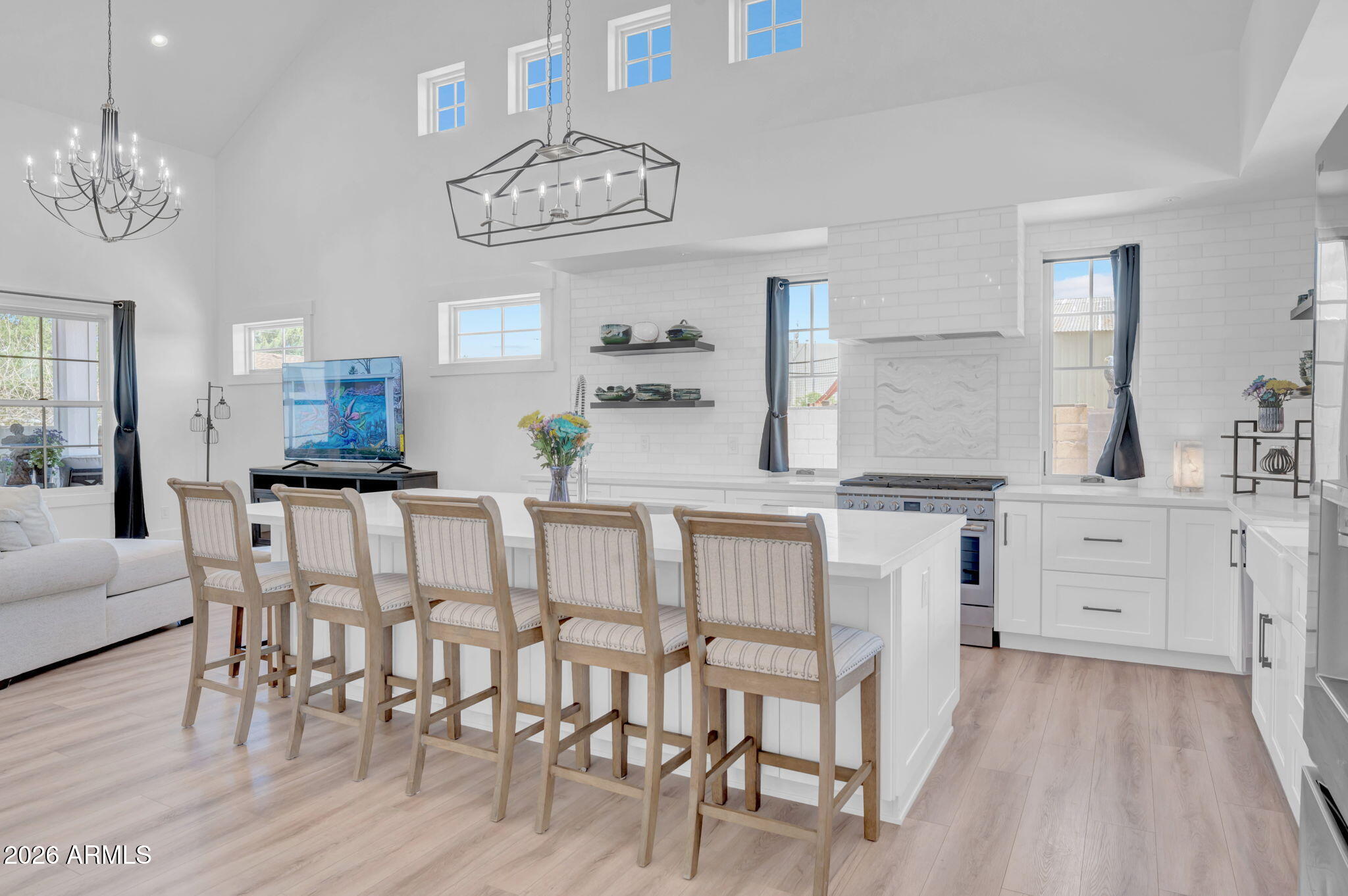 159 East Water Tank Road Gilbert, AZ 85296 - Photo 13 of 45 a kitchen with kitchen island granite countertop a table and chairs in it