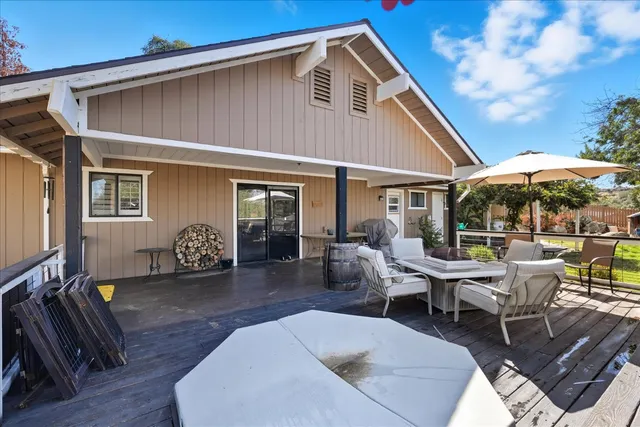 a patio with table and chairs