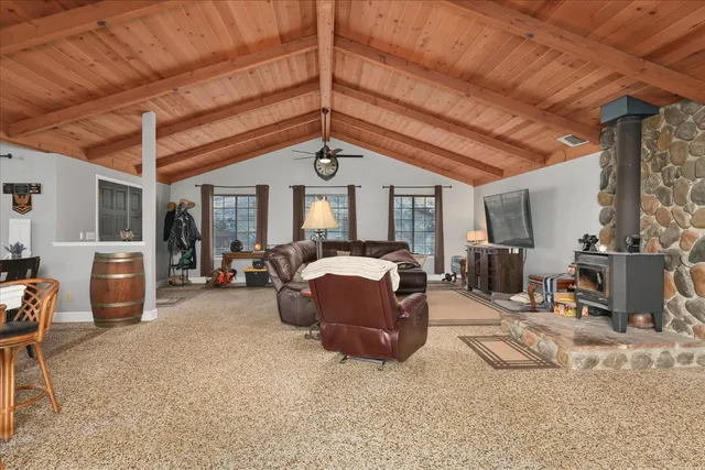 a living room with furniture and a mirror