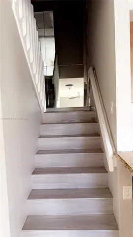 a view of an empty room and a window