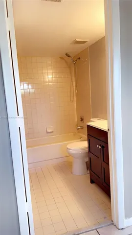 a bathroom with a toilet sink shower and bathtub