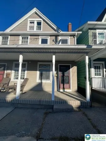 a front view of a house with garage