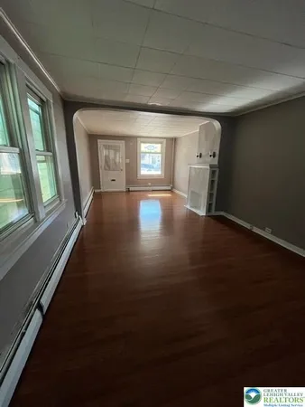 a view of livingroom with hardwood floor and window