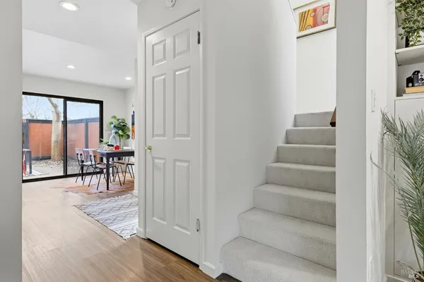 a view of entryway and hall with wooden floor