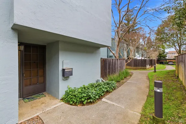 a front view of a house with garden
