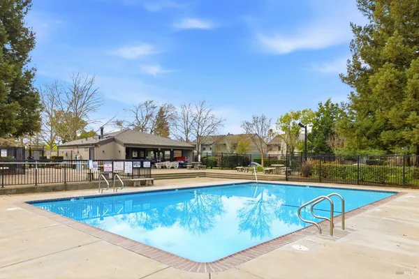 a view of a swimming pool with a lounge chair
