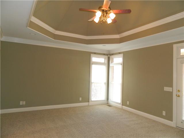 3207 Pugh Road Hermitage, TN 37076 - Photo 13 of 20 Owners Suite: 20 x 16 Located on the main level, this offers new plush carpeting, a vaulted treyed ceiling accented with trim, his & her walk-in closets, French Doors that access the covered porch, transom windows with wood blinds