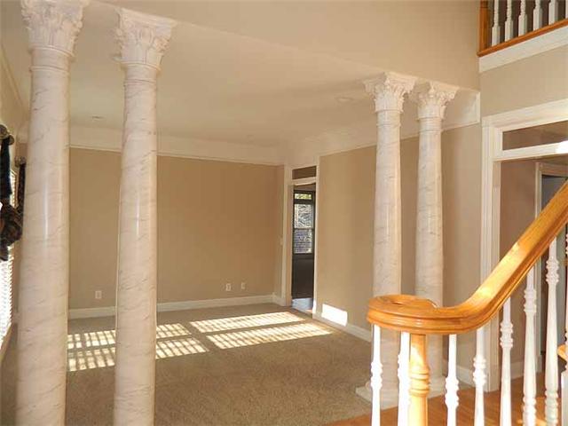 3207 Pugh Road Hermitage, TN 37076 - Photo 5 of 20 Formal Living Room: 13 x 14 this room offers new plush carpeting, wood blinds, crown trim, double window with transoms, column separation from the Entry Foyer and access the Den.