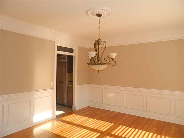3207 Pugh Road Hermitage, TN 37076 - Photo 6 of 20 Formal Dining Room: 15 x 13 finished with wainscoting, heavy trim, window transoms, wood blinds, new chandelier with medallion and hardwood flooring. This room opens to the Entry Foyer